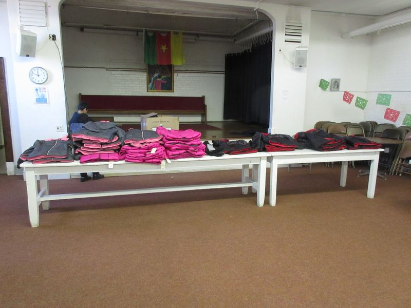 A room with many bags on the floor